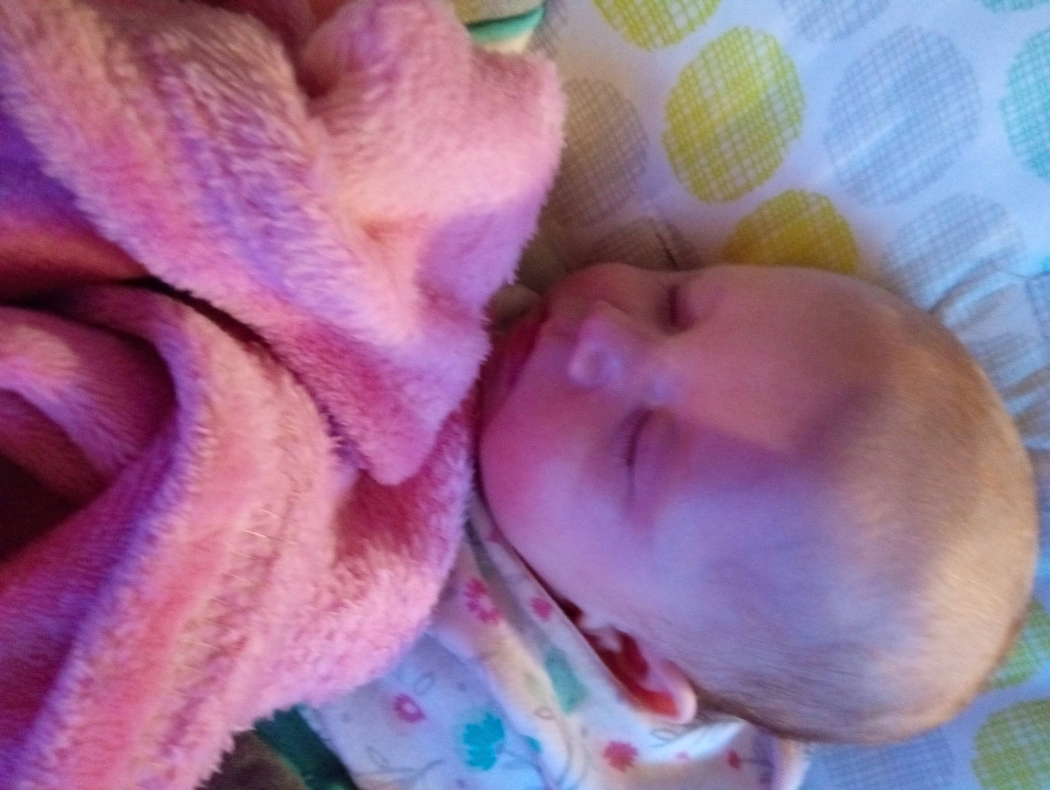 Winter is registered to the contest to win money with this photo: baby, baby_toddler_clothing, bedtime, cheek, child, chin, comfort, eye, human_body, linens, lip, magenta, mouth, nose, person, pink, purple, skin, textile, thumb