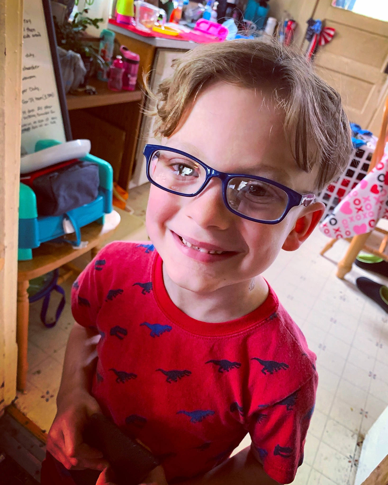 Brody is registered to the contest to win money with this photo: child, chin, cool, eyewear, fun, glasses, hair, hairstyle, happy, joy, leisure, neck, nose, person, pink, skin, smile, standing, summer, t_shirt