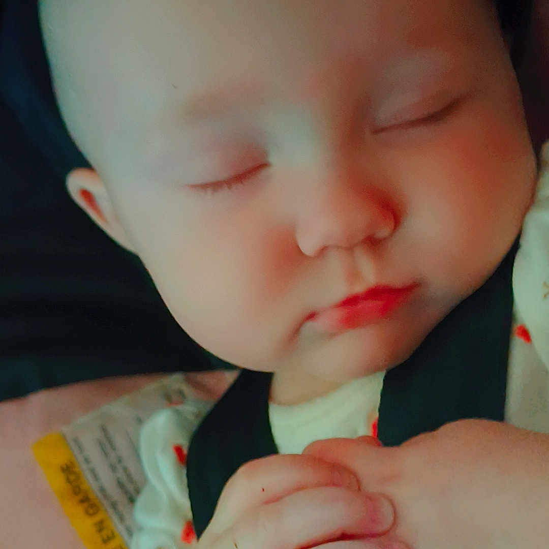 Karoleena is registered to the contest to win money with this photo: adorable, baby, butterfly_filter, car_seat, child, clasped_hands, closeup, cute, expression, face, hands, head, infant, peaceful, pink_butterflies, portrait, resting, sleeping, soft_lighting, young
