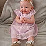 baby, smiling, dress, headband, golden_shoes, blanket, cute, happy, infant, sitting, portrait, clothing, adorable, child, indoor, soft_texture, young, person, small, fashion