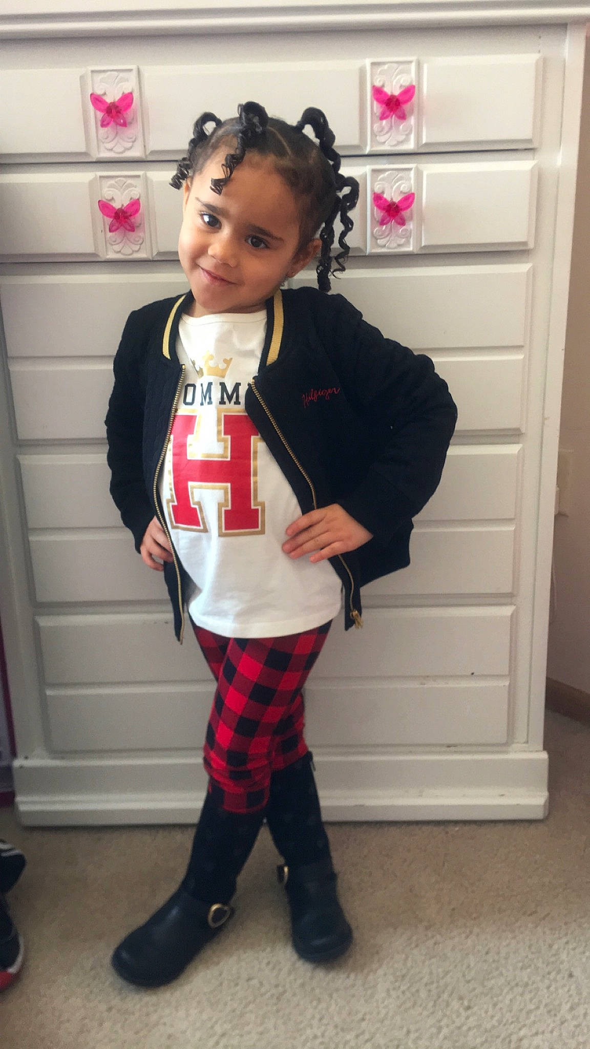 Shakayla is registered to the contest to win money with this photo: child, clothing, costume, design, fashion, footwear, head, joint, joy, knee, leg, leggings, outerwear, pattern, person, pink, plaid, shoe, standing, textile