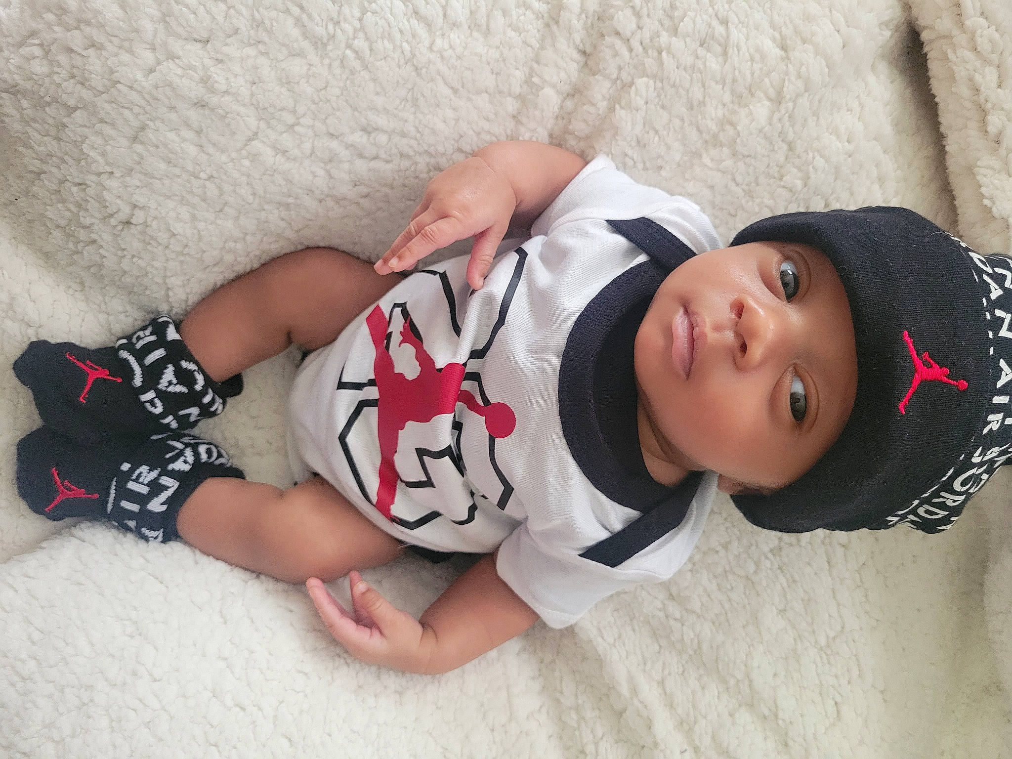 Tylen is registered to the contest to win money with this photo: arm, baby_toddler_clothing, black_hair, child, comfort, elbow, glasses, hand, headgear, headwear, human_body, joint, knee, mammal, neck, person, skin, sleeve, thigh, toddler