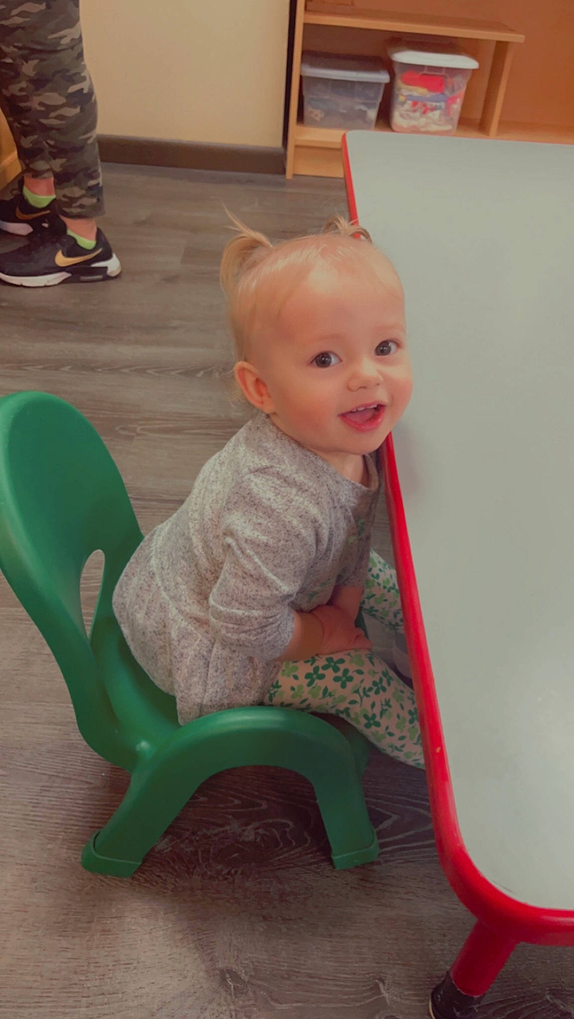 Mckinley is registered to the contest to win money with this photo: baby, baby_toddler_clothing, chair, child, comfort, flooring, fun, human_leg, knee, lap, magenta, person, plastic, play, riding_toy, room, sitting, smile, sock, toddler
