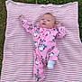 baby, infant, blanket, grass, outdoor, pink, onesie, clothing, cute, child, pattern, striped, socks, lying, person, nature, young, expression, head, face