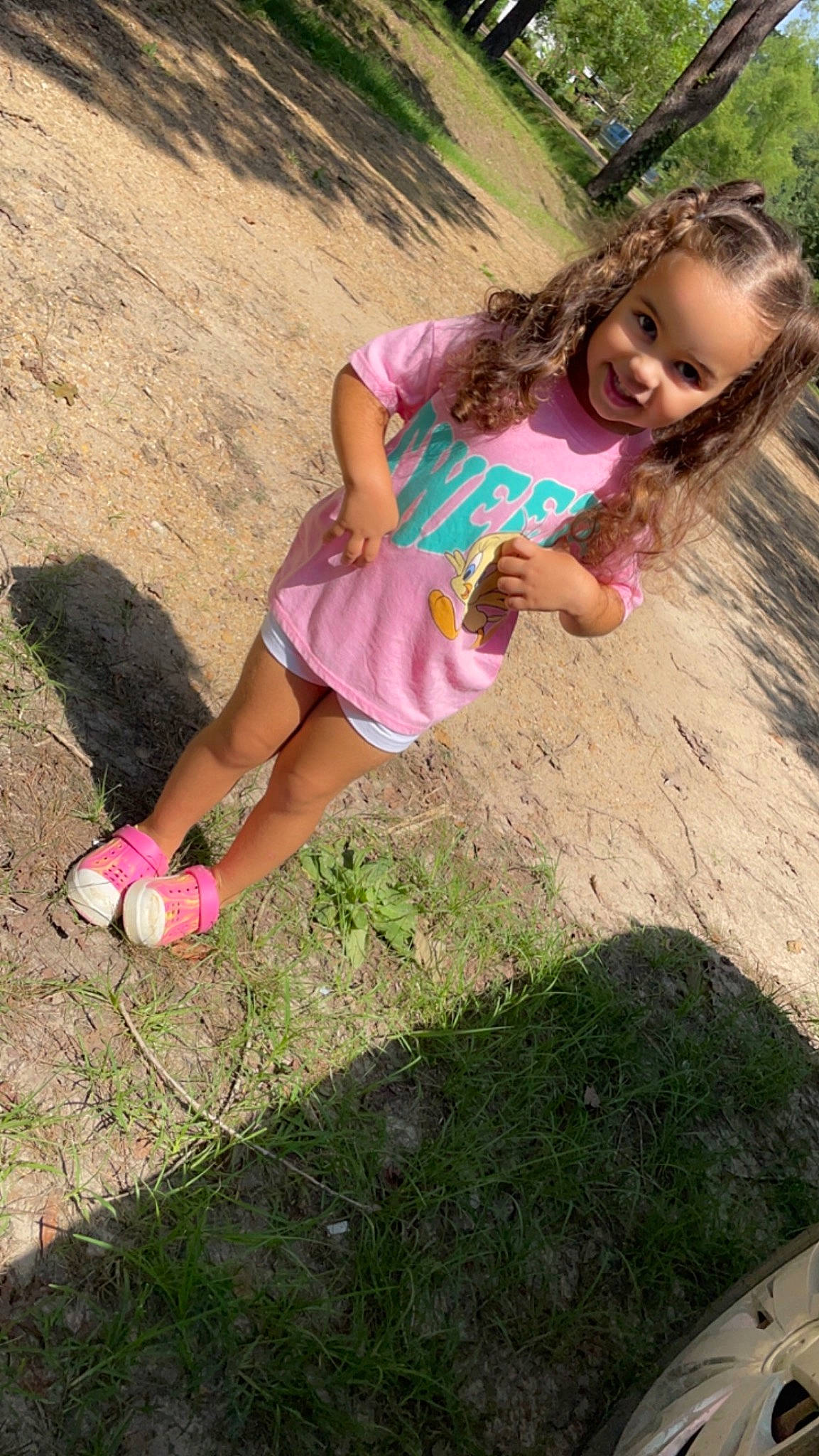 Maleigha is registered to the contest to win money with this photo: child, foot, fun, grass, happy, human_leg, joy, knee, leg, leisure, magenta, people_in_nature, person, pink, plant, recreation, sandal, smile, soil, thigh