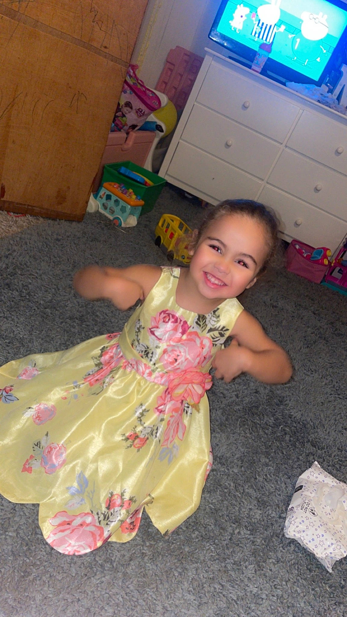 Maleigha is registered to the contest to win money with this photo: baby_toddler_clothing, child, event, floor, flooring, fun, happy, head, joy, leisure, magenta, pattern, person, pink, play, ruffle, sandal, shipping_box, sitting, smile