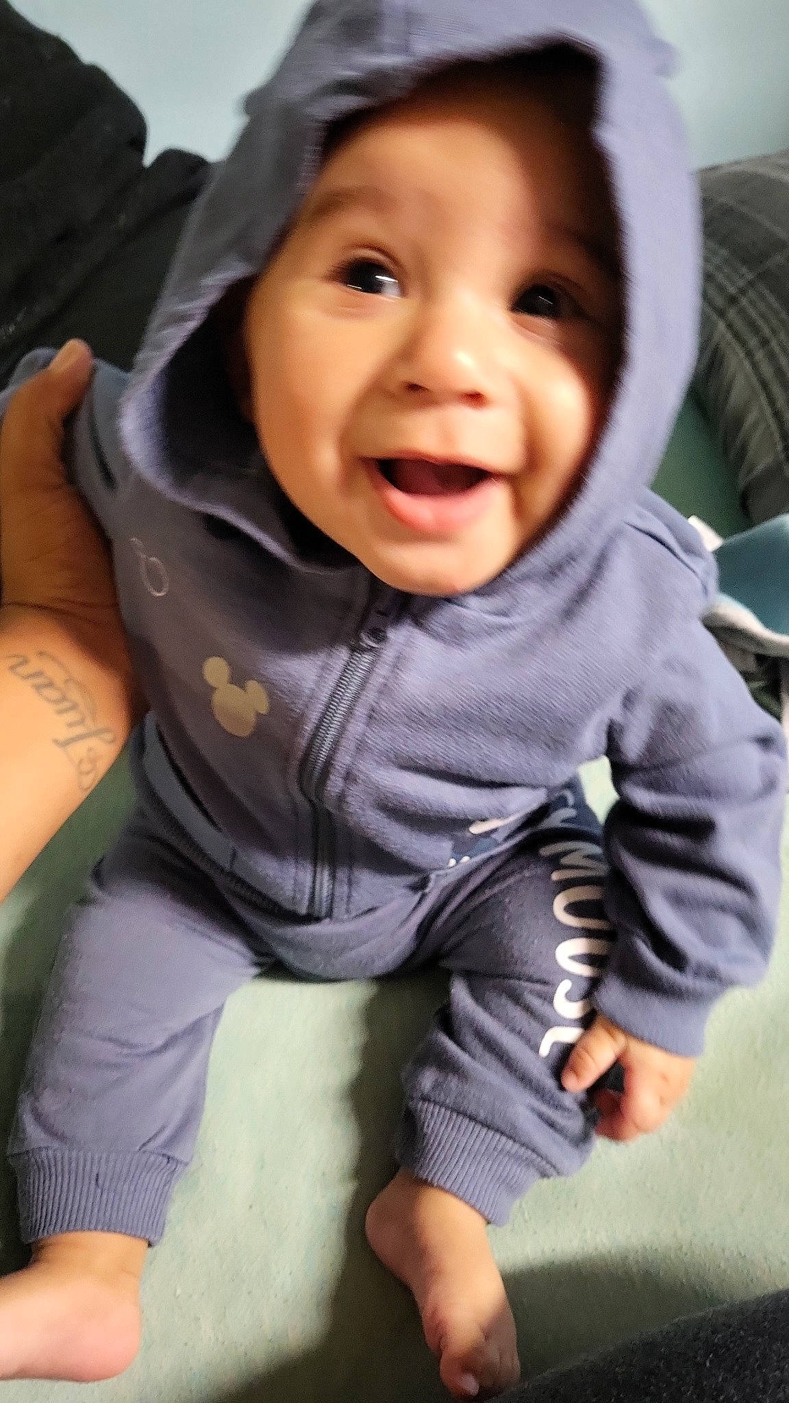 Damien joined the competition — help win amazing prizes! baby, baby_toddler_clothing, cheek, child, comfort, eye, finger, fun, gesture, grass, happy, headwear, lip, mouth, nose, person, sitting, skin, sleeve, smile