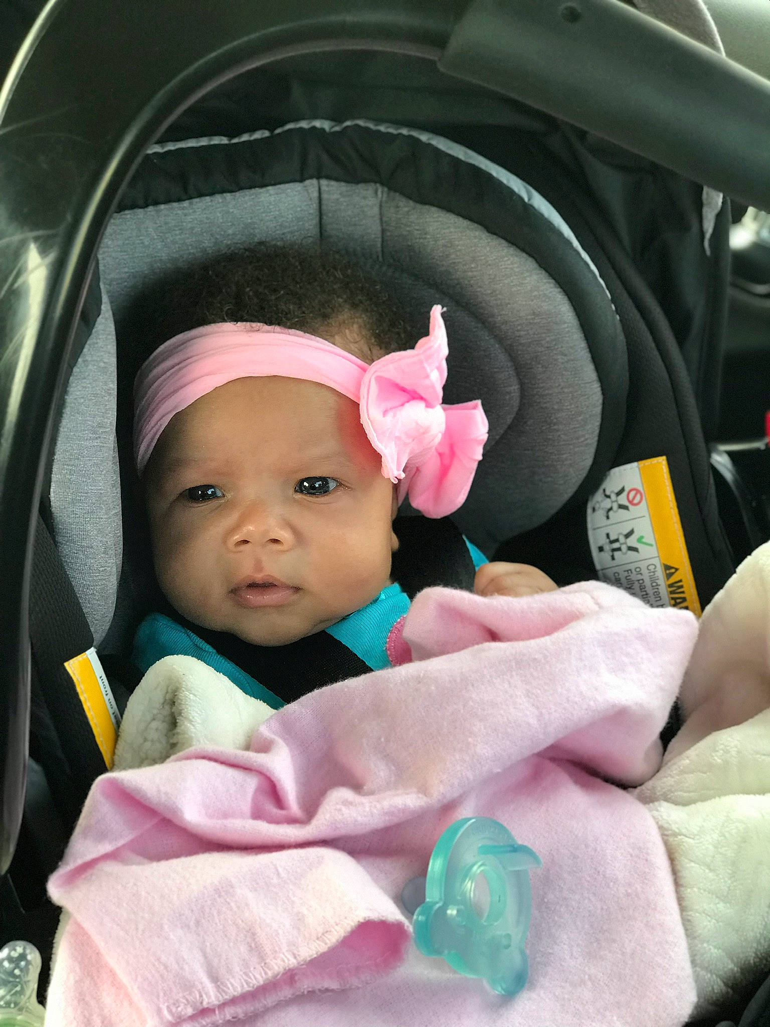 Mireya is registered to the contest to win money with this photo: car_seat, child, day, ear, eye, girl, infant, person, pink, product, skin, toddler