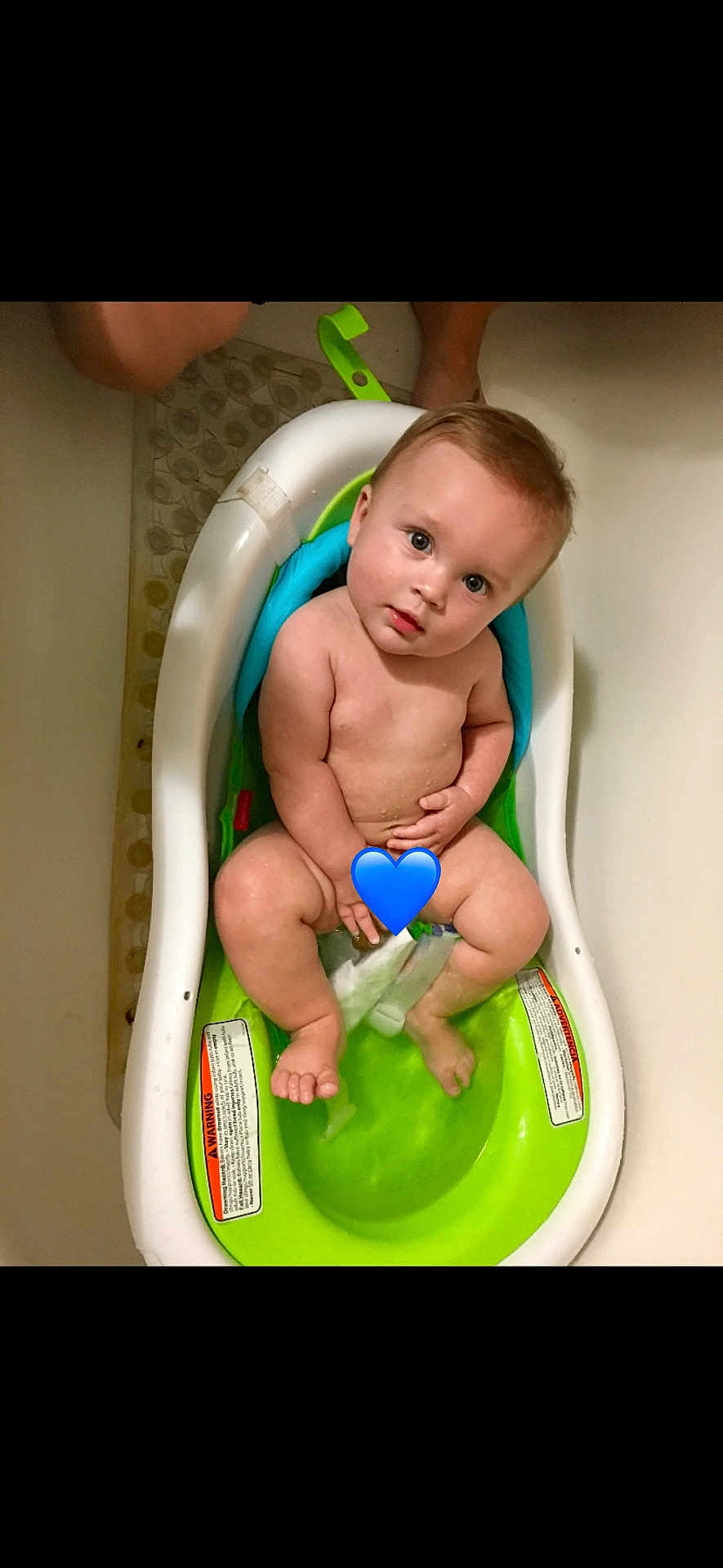 Ashton joined the competition — help win amazing prizes! baby, child, bath, bathtub, bathseat, water, skin, naked, infant, cute, looking_up, blue_heart_emoji, sitting, legs, feet, arm, head, expression, indoors, person