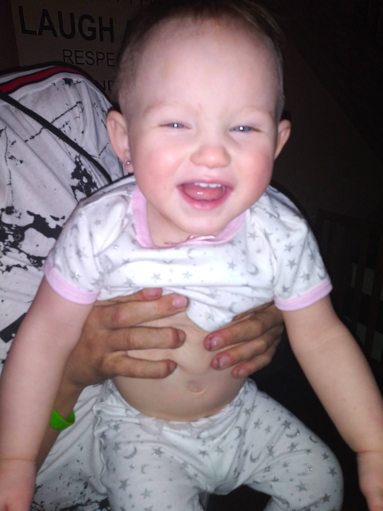 Natalie is registered to the contest to win money with this photo: baby, baby_toddler_clothing, cheek, child, facial_expression, finger, mouth, person, sitting, skin, smile, thumb, toddler