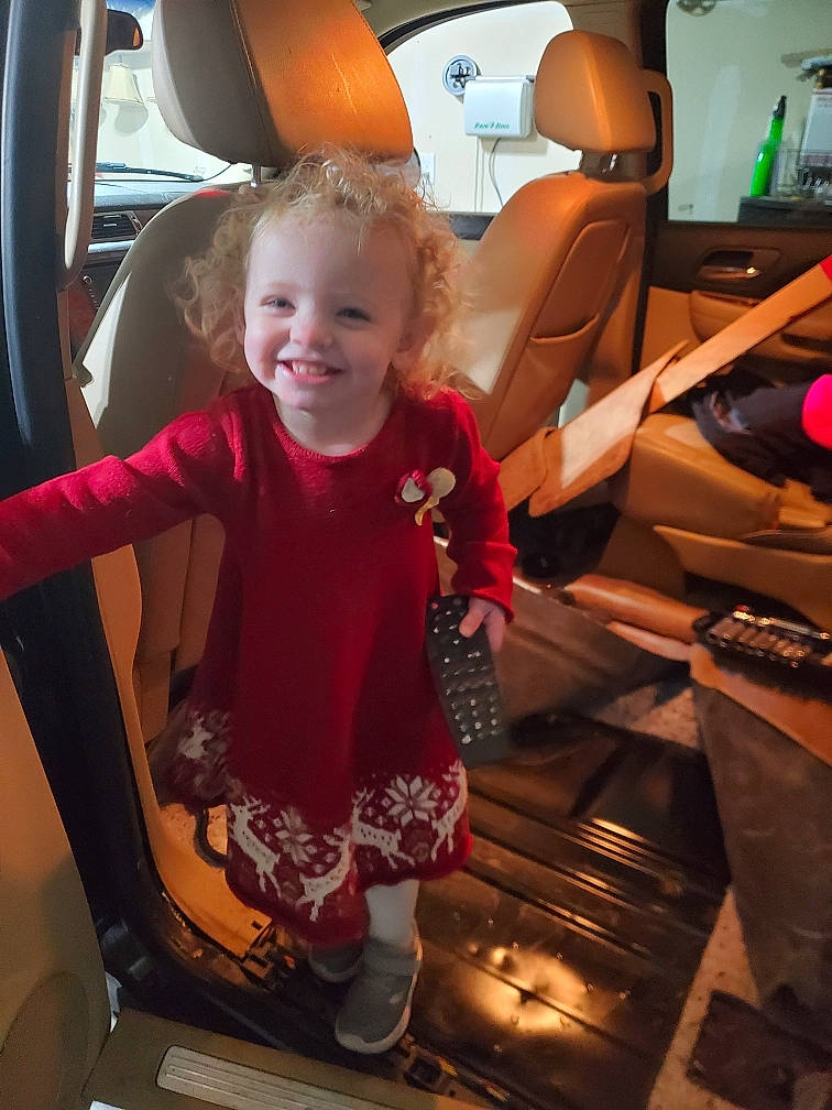 Bristol is registered to the contest to win money with this photo: auto_part, automotive_design, automotive_exterior, baby_toddler_clothing, car_seat, car_seat_cover, chair, child, cooking, family_car, fun, joy, luxury_vehicle, motor_vehicle, person, product, smile, steering_wheel, t_shirt, toddler