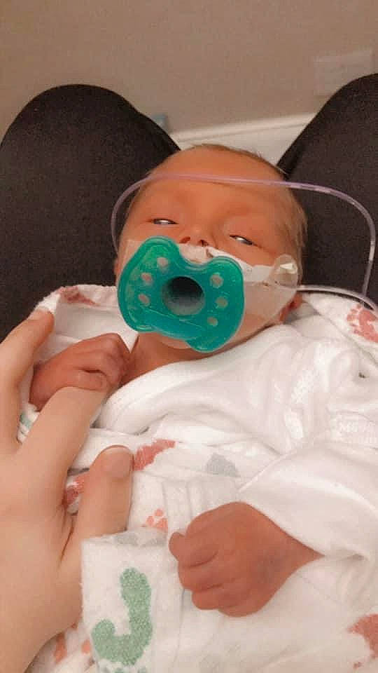 Jaxtyn is registered to the contest to win money with this photo: baby, baby_products, baby_toddler_clothing, cheek, child, comfort, drinkware, eyelash, finger, fun, health_care, mouth, nail, nose, person, plastic, room, service, skin, thumb