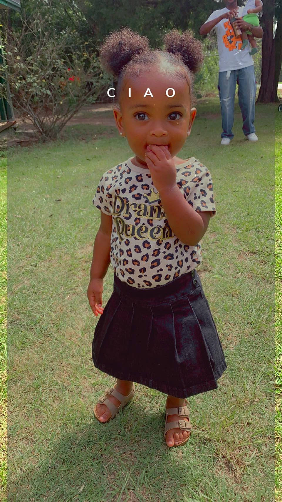 Tayler is registered to the contest to win money with this photo: baby_toddler_clothing, child, doll, fawn, fun, fur, garden, grass, hairstyle, leg, pattern, people_in_nature, person, pink, plant, sandal, sleeve, toddler, toy, waist