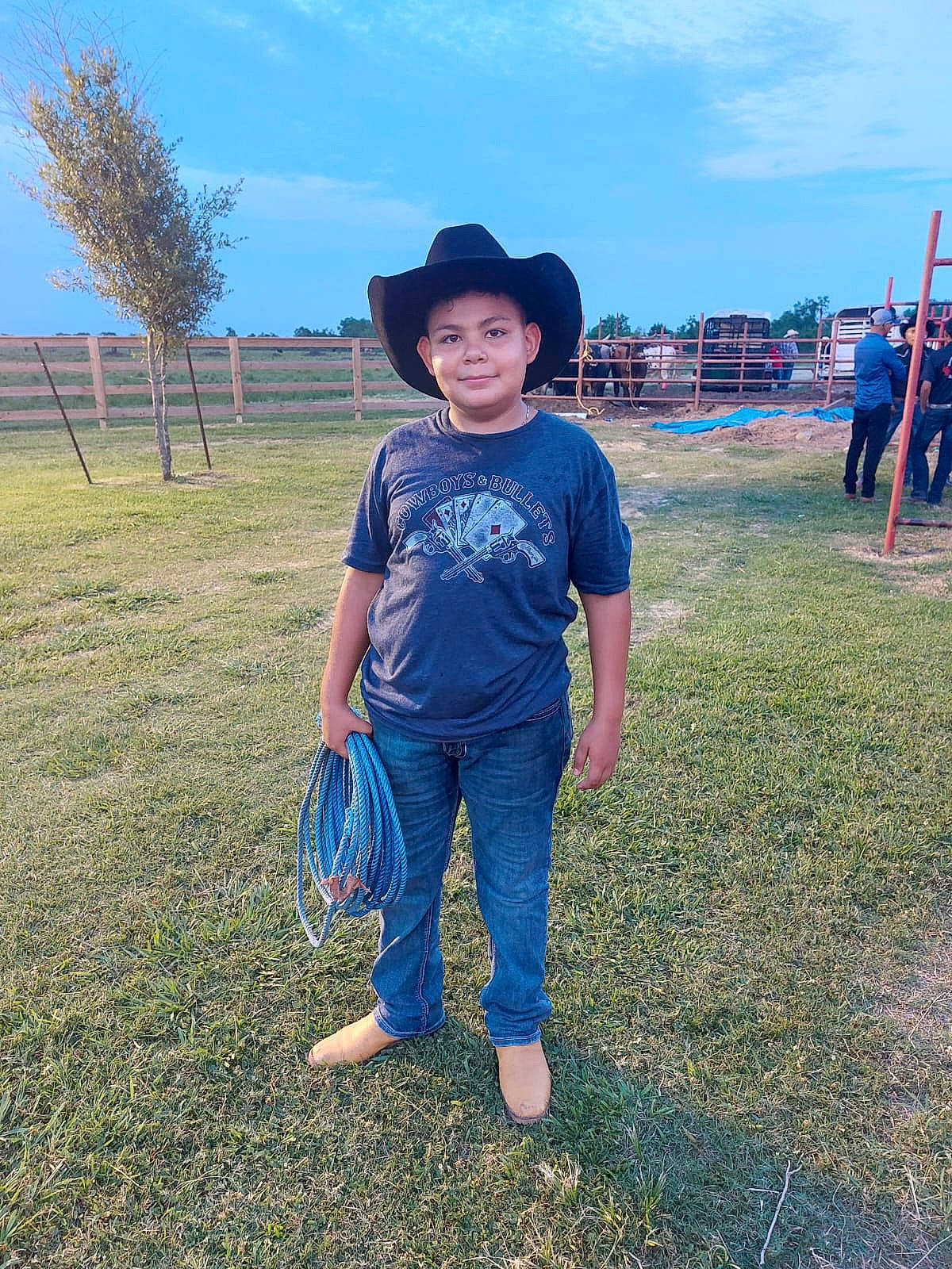Jose is registered to the contest to win money with this photo: azure, barefoot, cloud, electric_blue, fun, grass, grassland, happy, hat, joy, landscape, leisure, meadow, natural_environment, people_in_nature, person, plant, sky, smile, summer