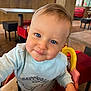 toddler, child, blue_eyes, high_chair, sweater, happiness, smile, indoor, restaurant, table, chair, furniture, wooden_wall, colorful, cute, portrait, baby, face, person, happy