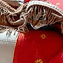 Wendi participe au concours pour gagner de l'argent avec cette photo : animal, blanket, cat, closeup, comfort, cozy, curious, fabric, feline, fringe, home, indoor, pet, red_cushion, relaxed, resting, soft, textile, warm, yellow_pattern