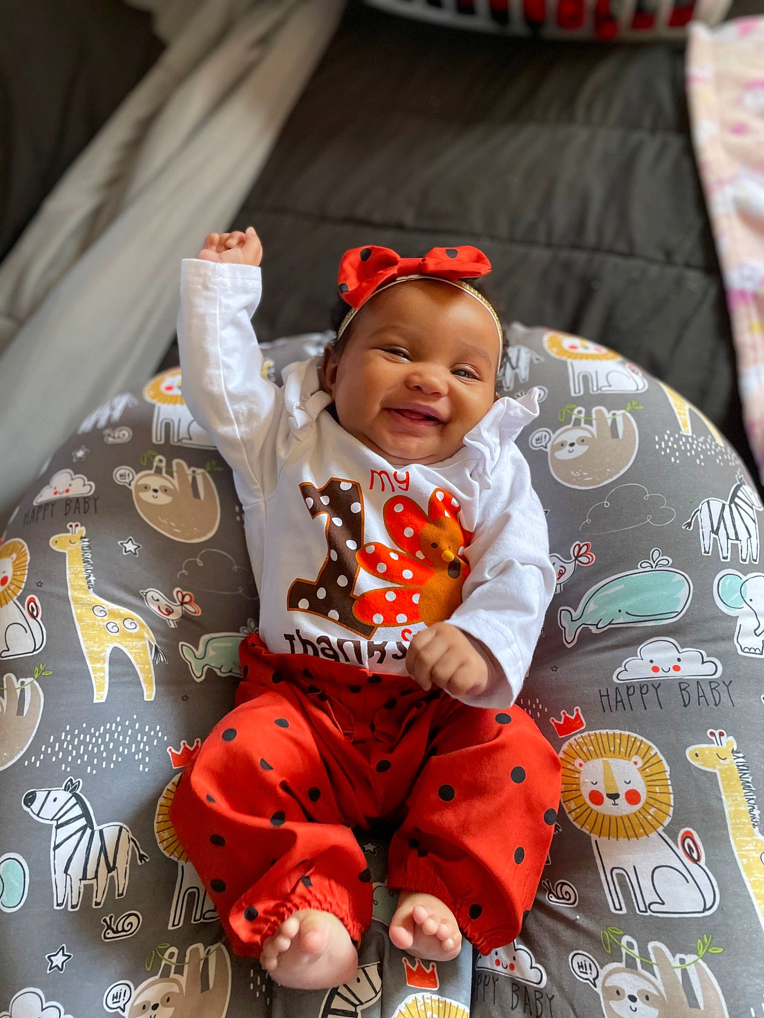 Alessia is registered to the contest to win money with this photo: baby, baby_products, baby_toddler_clothing, child, couch, home_accessories, human_body, linens, nightwear, nose, overall, person, sleeve, throw_pillow, toddler