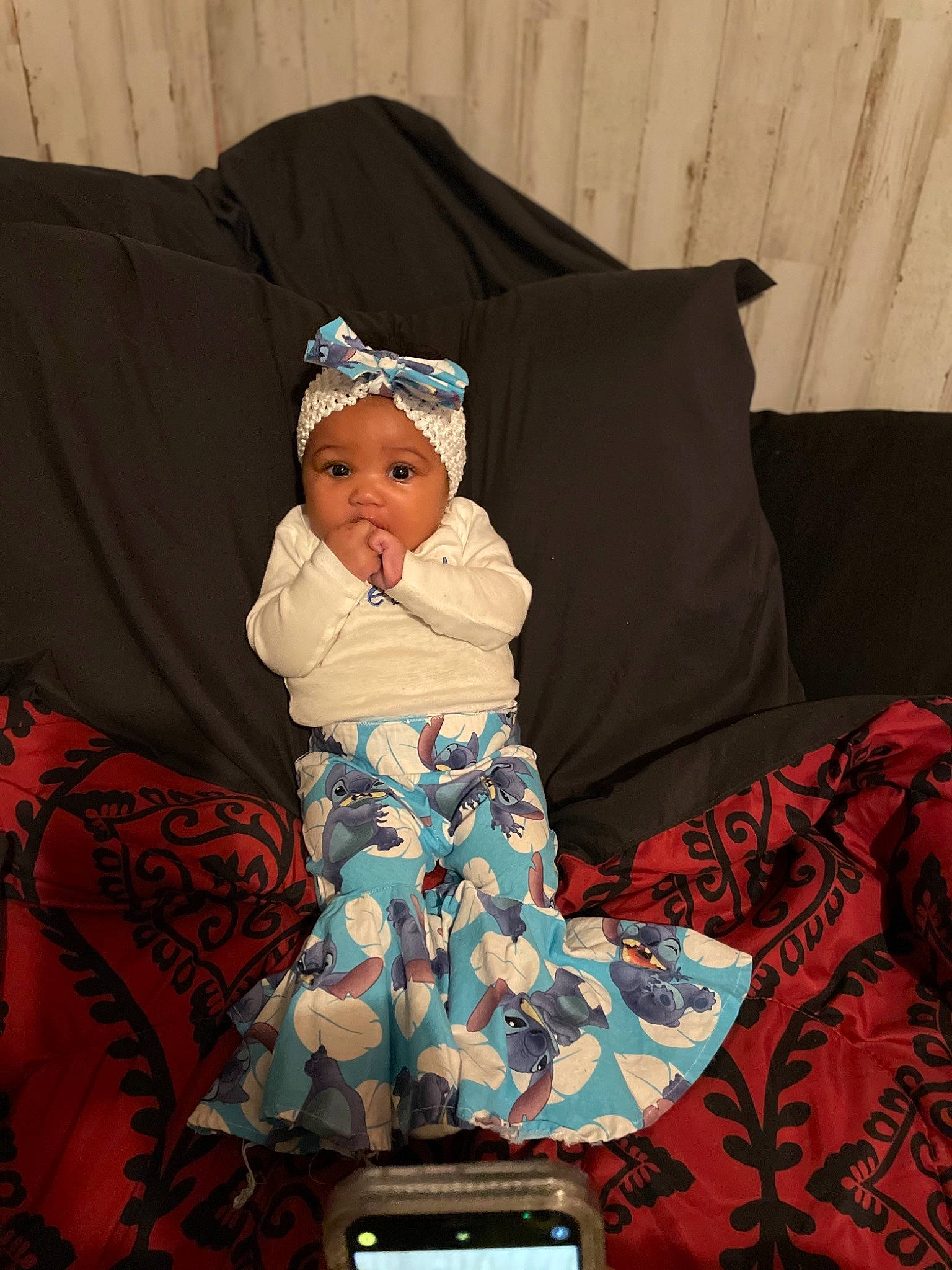 Alessia joined the competition — help win amazing prizes! baby, baby_toddler_clothing, bonnet, communication_device, costume_accessory, costume_hat, couch, electronics, embellishment, gadget, hair_accessory, headband, headpiece, headwear, living_room, mobile_device, mobile_phone, person, portable_communications_device, telephony