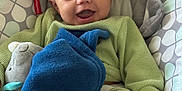 Alian joined the competition — help win amazing prizes! baby, smiling, infant, green_clothing, blue_blanket, plush_toy, baby_seat, cushion, patterned_fabric, happy, small_hand, small_foot, indoor, portrait, cute, child, cozy, soft_texture, closeup, person