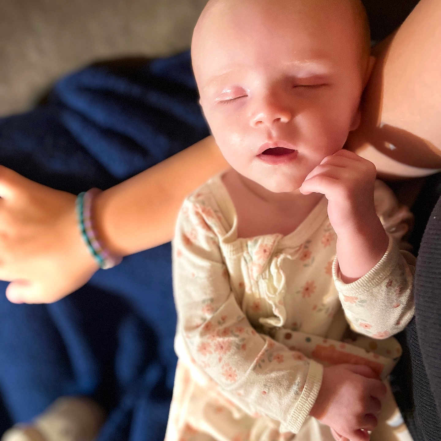 Sophia is registered to the contest to win money with this photo: arm, baby, blanket, bottle, bracelet, child, closeup, cozy, face, hand, indoor, infant, pajamas, parent, peaceful, person, resting, skin, sleeping, soft_light