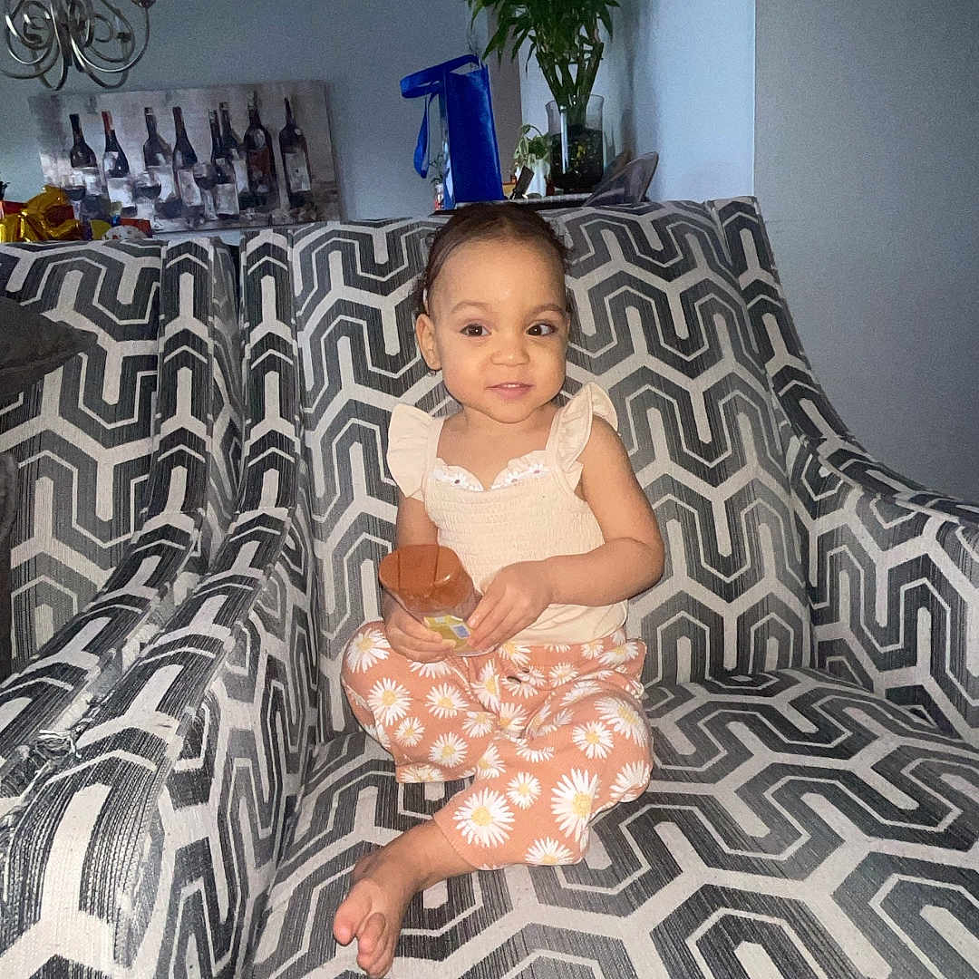 Isabella joined the competition — help win amazing prizes! baby, bed, bedroom, blanket, couch, cushion, face, furniture, head, homedecor, indoors, lamp, person, photography, plant, portrait, pottedplant, quilt, room, sitting