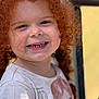 child, toddler, red_hair, curly_hair, smile, face, portrait, clothing, shirt, cartoon_character, happy, outdoor, sunlight, closeup, person, cute, young, skin, head, expression