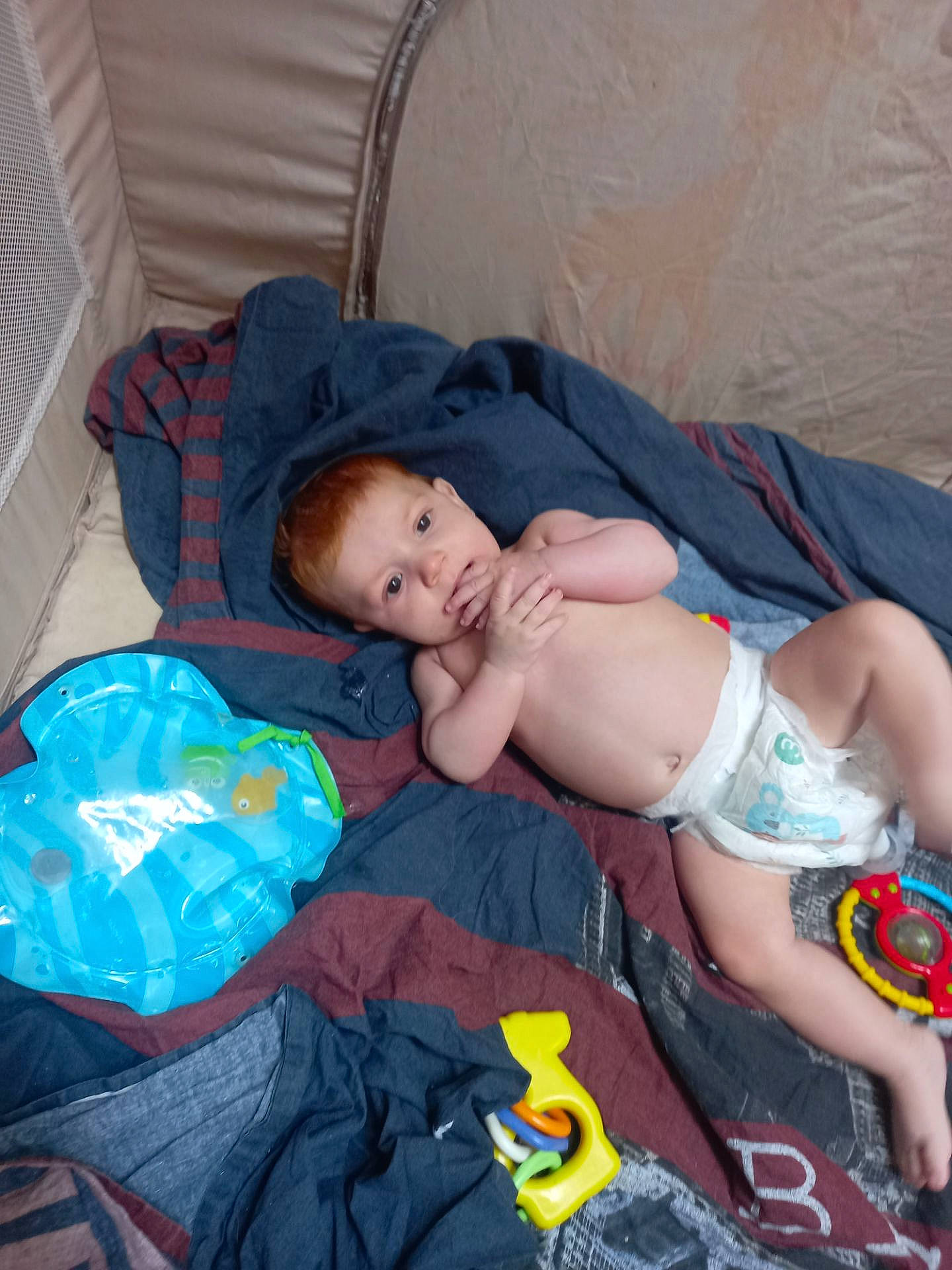Noah participe au concours pour gagner de l'argent avec cette photo : abdomen, baby, baby_products, baby_toddler_clothing, bedtime, chest, child, comfort, face, hat, head, linens, nap, person, plastic, room, sitting, sleep, thigh, toddler