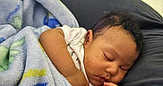 Bahri is registered to the contest to win money with this photo: baby, sleeping, blanket, infant, child, resting, indoors, cushion, soft, cozy, peaceful, cute, person, portrait, toddler, relaxation, sleep, young, hand, face