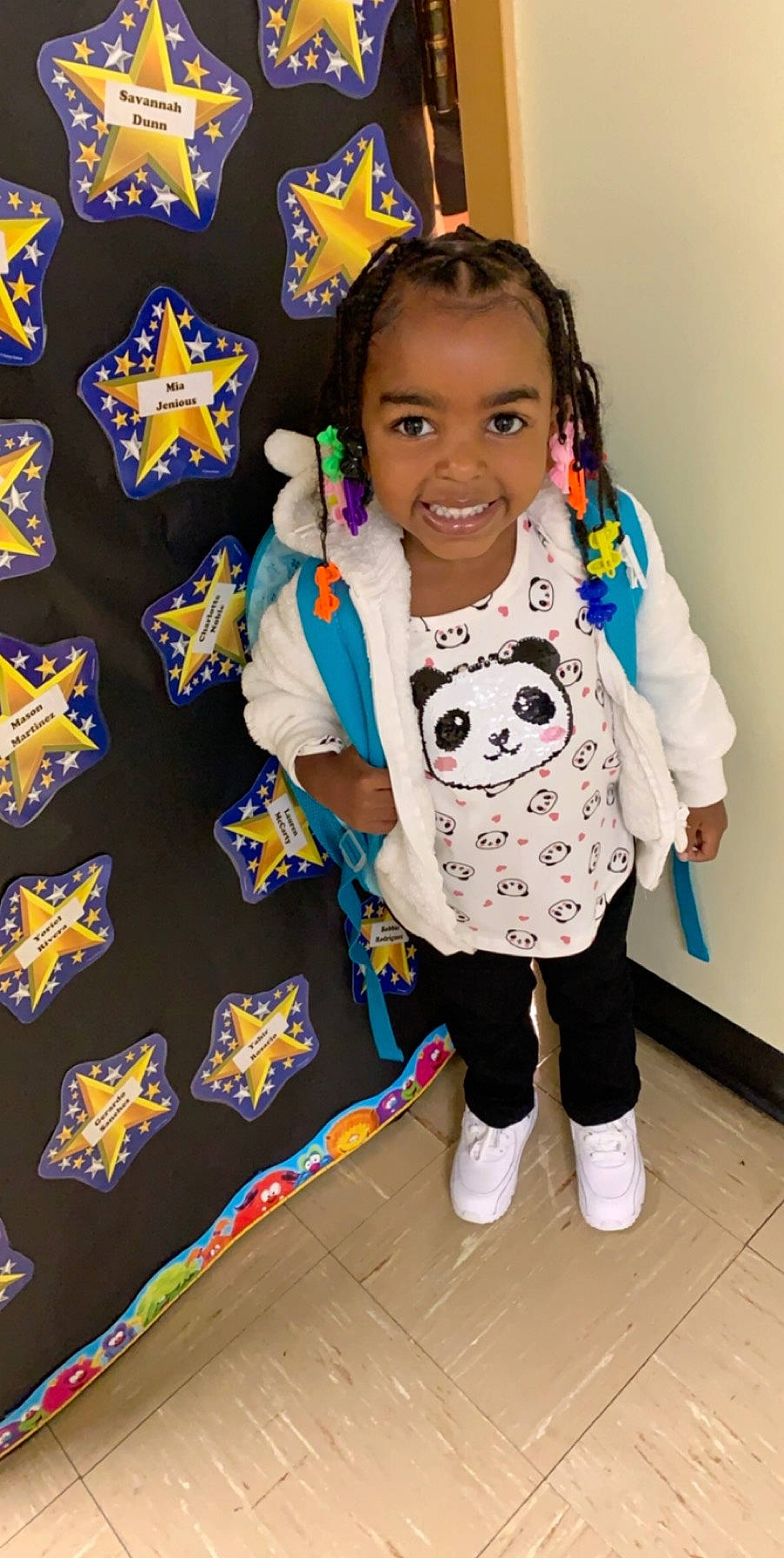 Mia is registered to the contest to win money with this photo: baby, child, joy, outerwear, person, play, room, textile, toddler