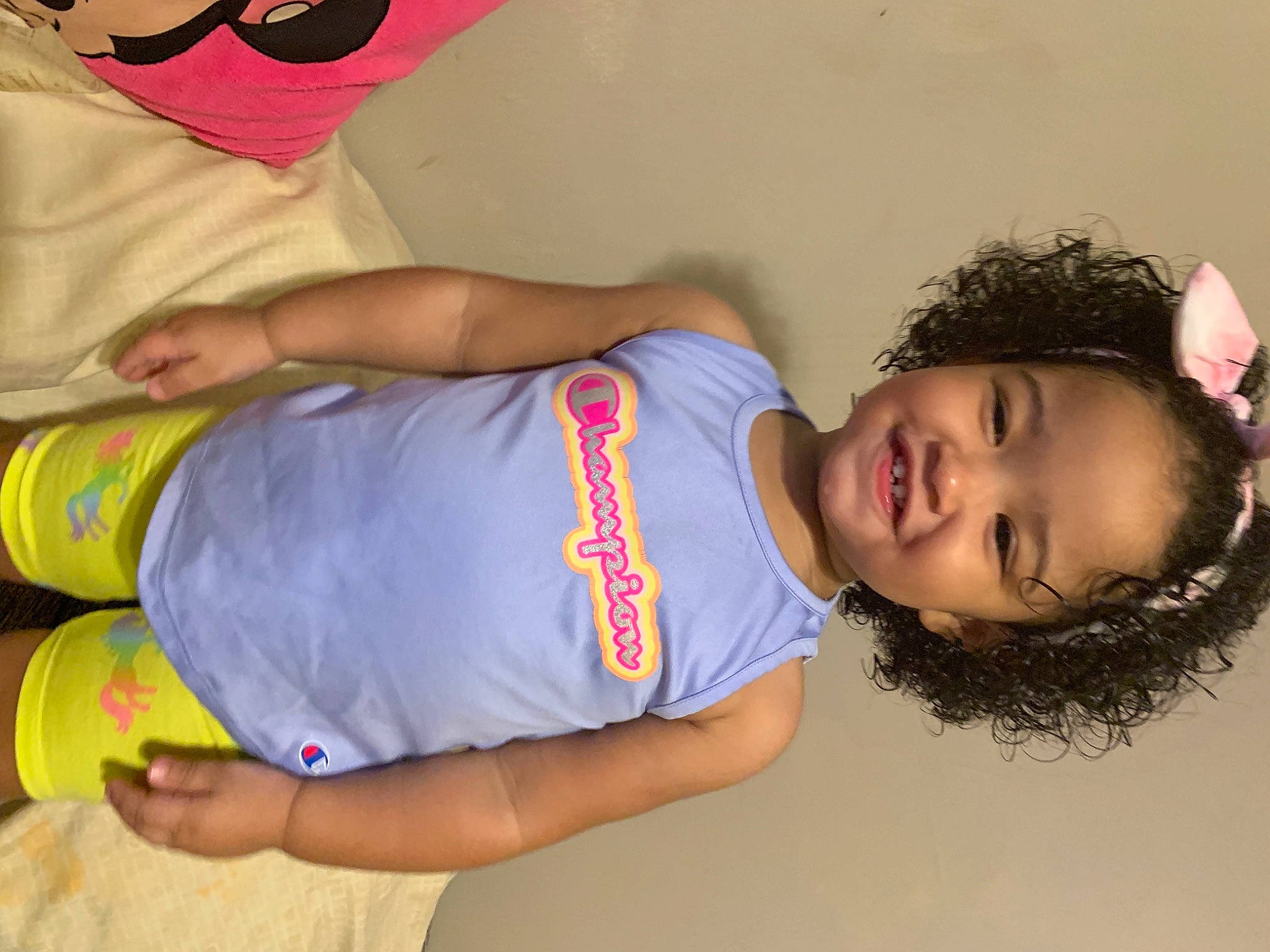 Cataleya is registered to the contest to win money with this photo: child, clothing, elbow, electric_blue, facial_expression, fun, happy, human_leg, joint, joy, knee, leg, mouth, organ, person, room, skin, smile, t_shirt, thigh