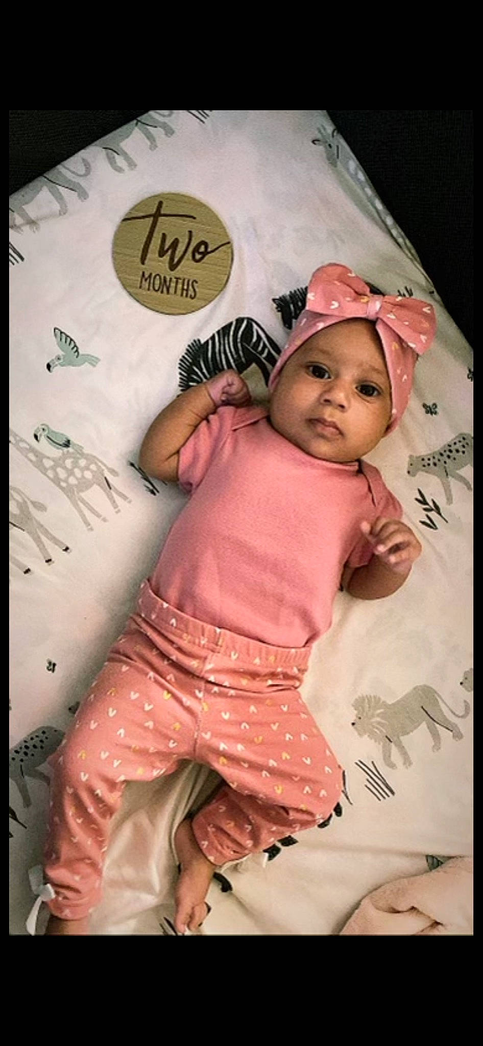 Amiiyah is registered to the contest to win money with this photo: baby, baby_toddler_clothing, cap, cheek, child, design, finger, flash_photography, font, fun, happy, headwear, magenta, pattern, person, pink, product, skin, sleeve, t_shirt