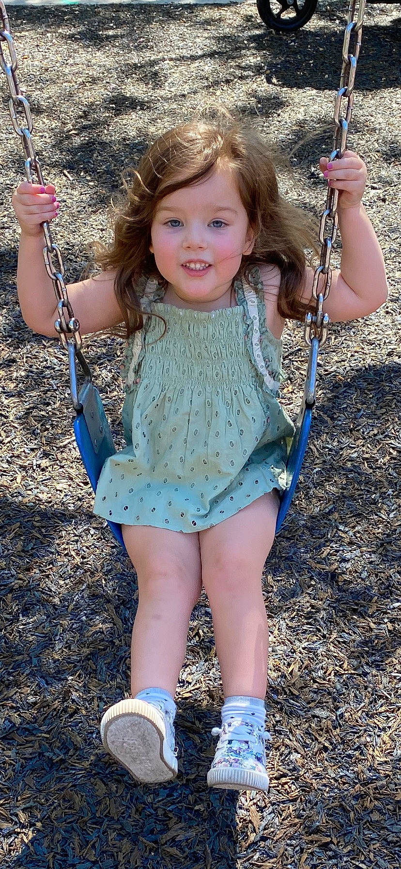 Charlotte joined the competition — help win amazing prizes! blue, face, facial_expression, finger, fun, grass, hair, hairstyle, happy, joint, joy, people_in_nature, person, photograph, pink, smile, summer, swing, thigh, toddler