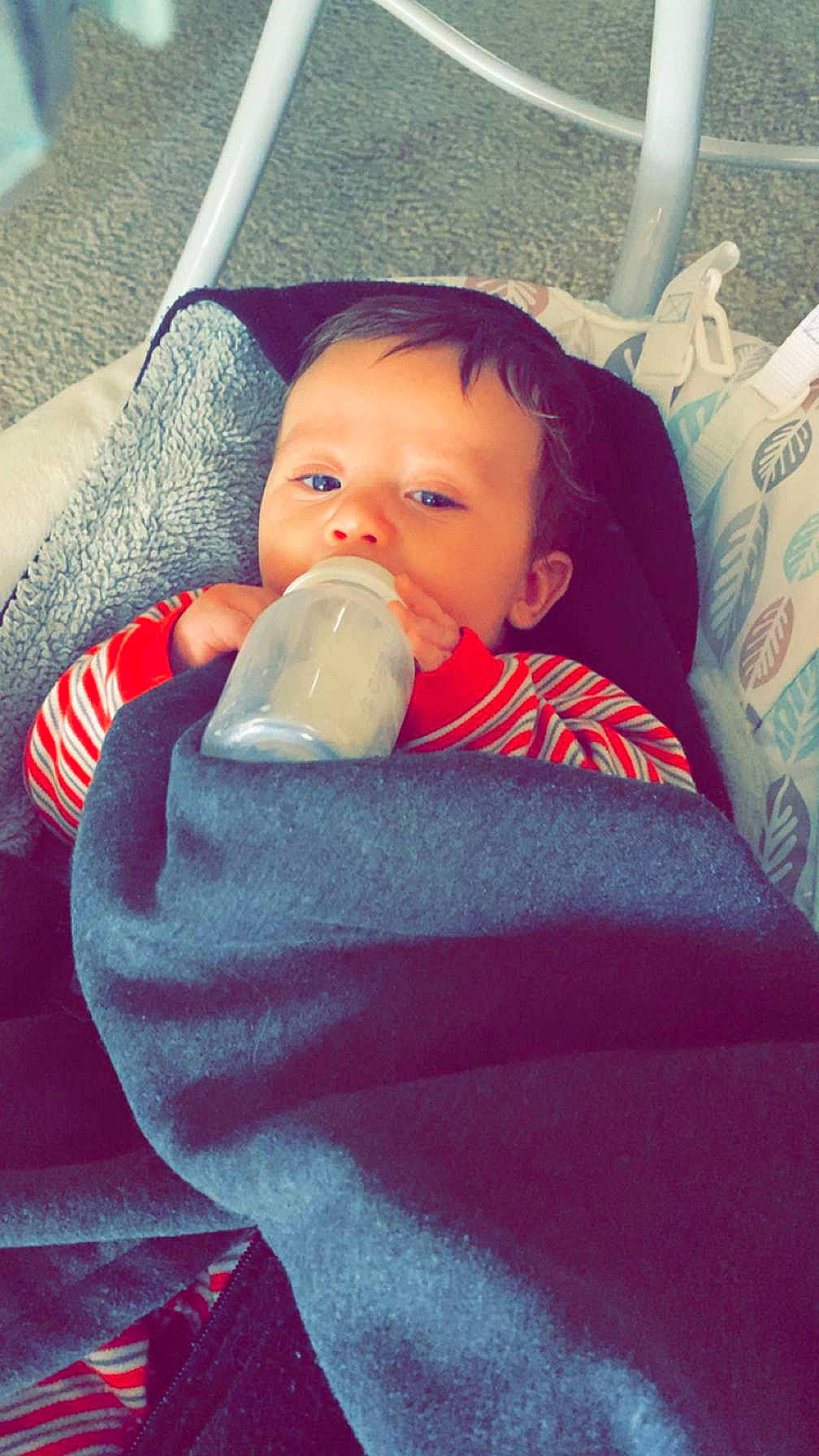 Leon joined the competition — help win amazing prizes! baby, baby_products, baby_toddler_clothing, cheek, chin, comfort, drinkware, ear, electric_blue, eye, face, finger, happy, head, lip, mouth, nose, person, plastic_bottle, skin