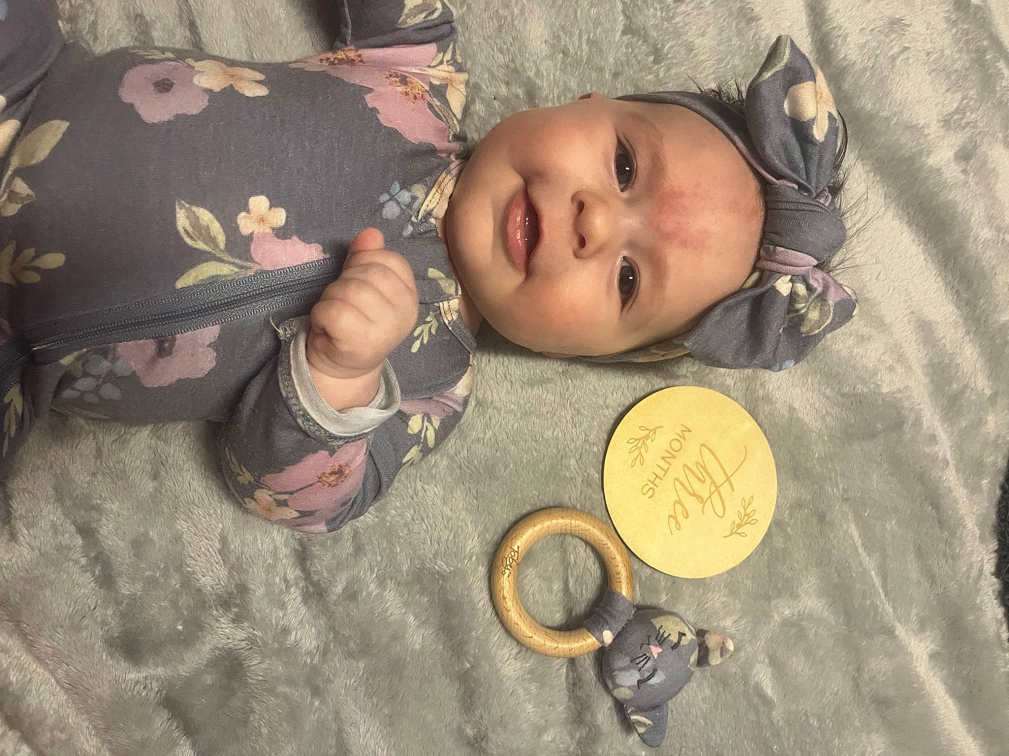 Josie is registered to the contest to win money with this photo: baby, baby_toddler_clothing, cheek, child, circle, comfort, currency, eye, fashion_accessory, finger, fun, happy, headwear, metal, pattern, person, skin, smile, thumb, toddler