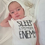 Orrin joined the competition — help win amazing prizes! newborn, baby, infant, child, portrait, sleeping, awake, onesie, white_clothing, hat, bed, bedding, blanket, indoor, closeup, face, eyes, hands, text_on_clothing, adorable