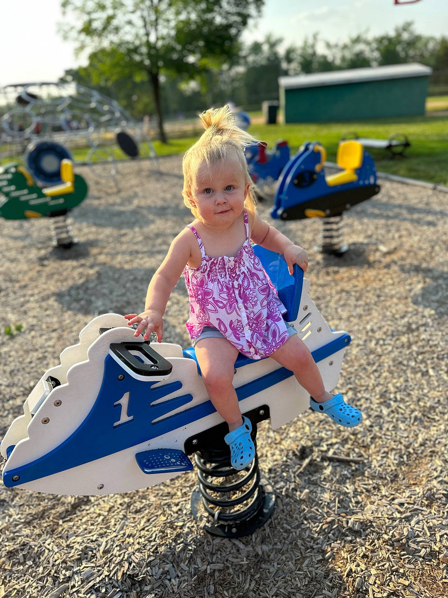 Alice joined the competition — help win amazing prizes! asphalt, child, city, electric_blue, fun, grass, happy, human_leg, leisure, people_in_nature, person, public_space, recreation, sky, smile, sneakers, thigh, toddler, toy, tree