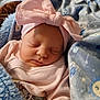 Paisleigh is registered to the contest to win money with this photo: baby, sleeping, blanket, pink_bow, headband, soft_texture, infant, cute, cozy, clothing, wrapped, peaceful, closeup, indoor, child, adorable, face, resting, newborn, comfort