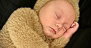 Lucas joined the competition — help win amazing prizes! baby, bear_costume, black_background, close_up, closed_eyes, costume, cozy, cute, fur, hand, hat, infant, newborn, peaceful, plush, portrait, restful, skin, sleeping, soft_texture