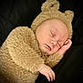 Lucas joined the competition — help win amazing prizes! baby, infant, sleeping, bear_costume, costume, hat, plush, fur, hand, closed_eyes, peaceful, portrait, close_up, cozy, black_background, soft_texture, newborn, cute, restful, skin