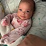Sabrina is registered to the contest to win money with this photo: baby, infant, blanket, pillow, hand, face, eyes, clothing, cute, indoors, soft, pattern, ladybug, pink, white, comfort, child, newborn, resting, cozy