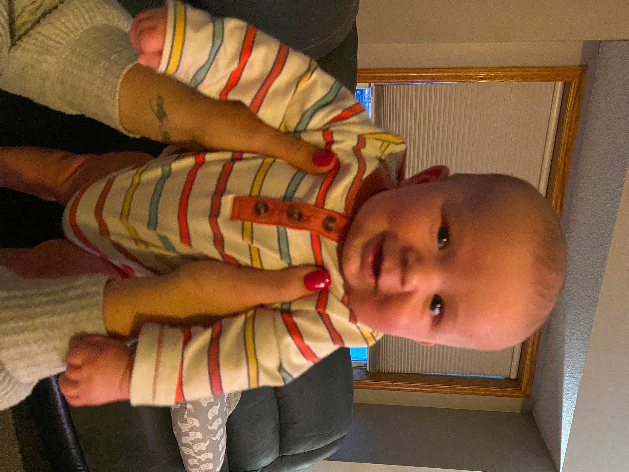 Theodore is registered to the contest to win money with this photo: arm, baby, baby_safety, baby_toddler_clothing, cheek, clothing, comfort, eye, finger, gesture, hand, human_body, joy, mouth, nose, person, skin, sleeve, smile, thumb
