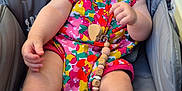 Romane participe au concours pour gagner de l'argent avec cette photo : baby, child, infant, smiling, colorful_clothing, pacifier, beads, seat, gray, cute, happy, portrait, outdoor, skin, hand, foot, eyes, toy, comfort, young