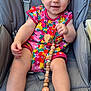 baby, child, infant, smiling, colorful_clothing, pacifier, beads, seat, gray, cute, happy, portrait, outdoor, skin, hand, foot, eyes, toy, comfort, young