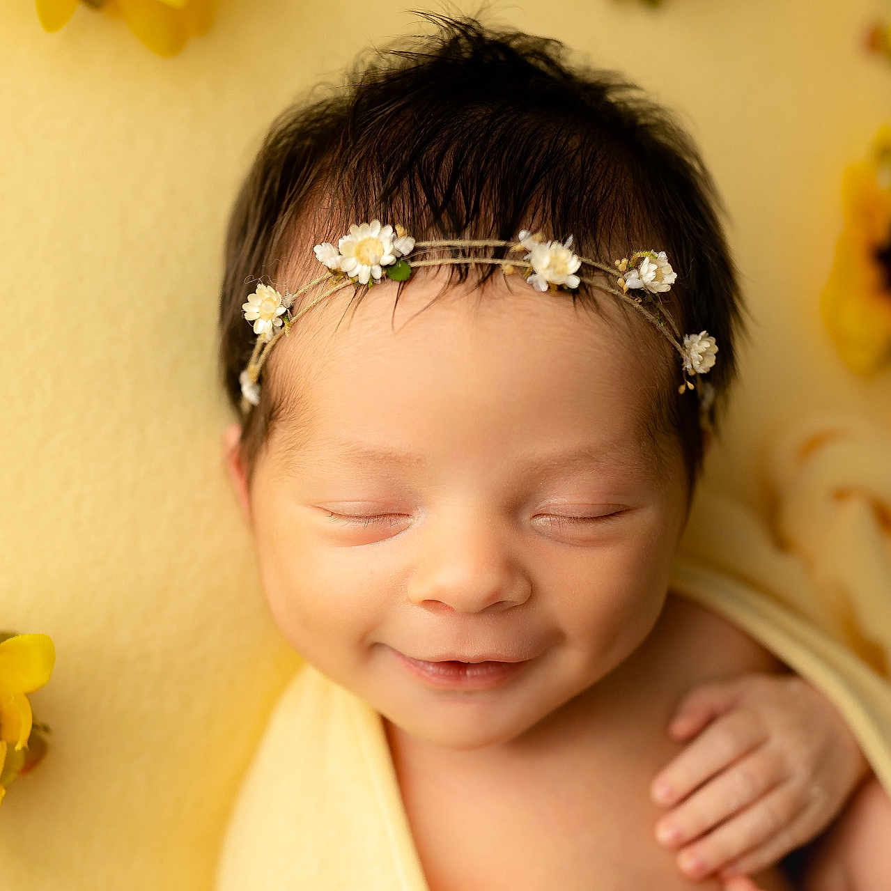 Hazelynn is registered to the contest to win money with this photo: accessories, baby, bodypart, daisy, face, finger, flower, flowerarrangement, flowerbouquet, hand, happy, head, headband, newborn, person, photography, plant, portrait, smile, sunflower