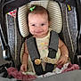 baby, car_seat, child, smiling, hair_clip, blanket, seatbelt, infant, cute, happy, indoors, clothing, portrait, child_seat, safety, person, small_child, comfort, baby_girl, seat