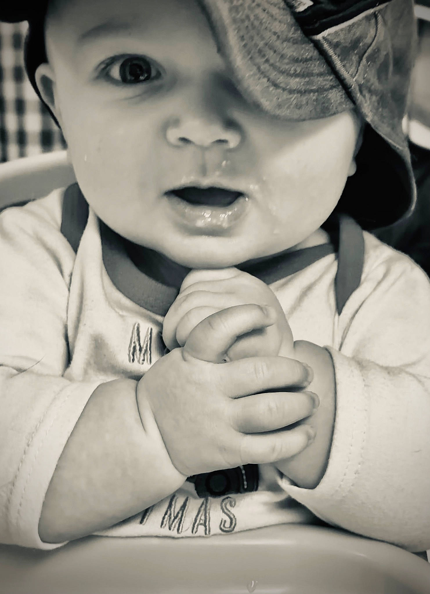 Jacob is registered to the contest to win money with this photo: arm, black, black_and_white, cap, cool, eyebrow, face, finger, gesture, hand, happy, headwear, lip, mouth, nose, organ, person, photograph, skin, smile