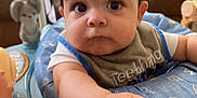 Lorenzo is registered to the contest to win money with this photo: architecture, baby, bodypart, building, clothing, couch, cushion, face, finger, furniture, hand, head, homedecor, indoors, livingroom, pants, person, photography, portrait, sitting