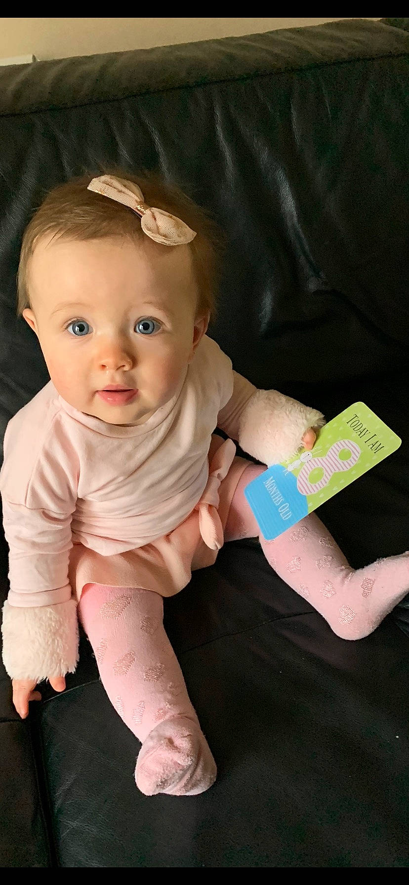 Alexia is registered to the contest to win money with this photo: arm, baby, baby_toddler_clothing, cheek, child, finger, hand, joint, person, sitting, skin, toddler