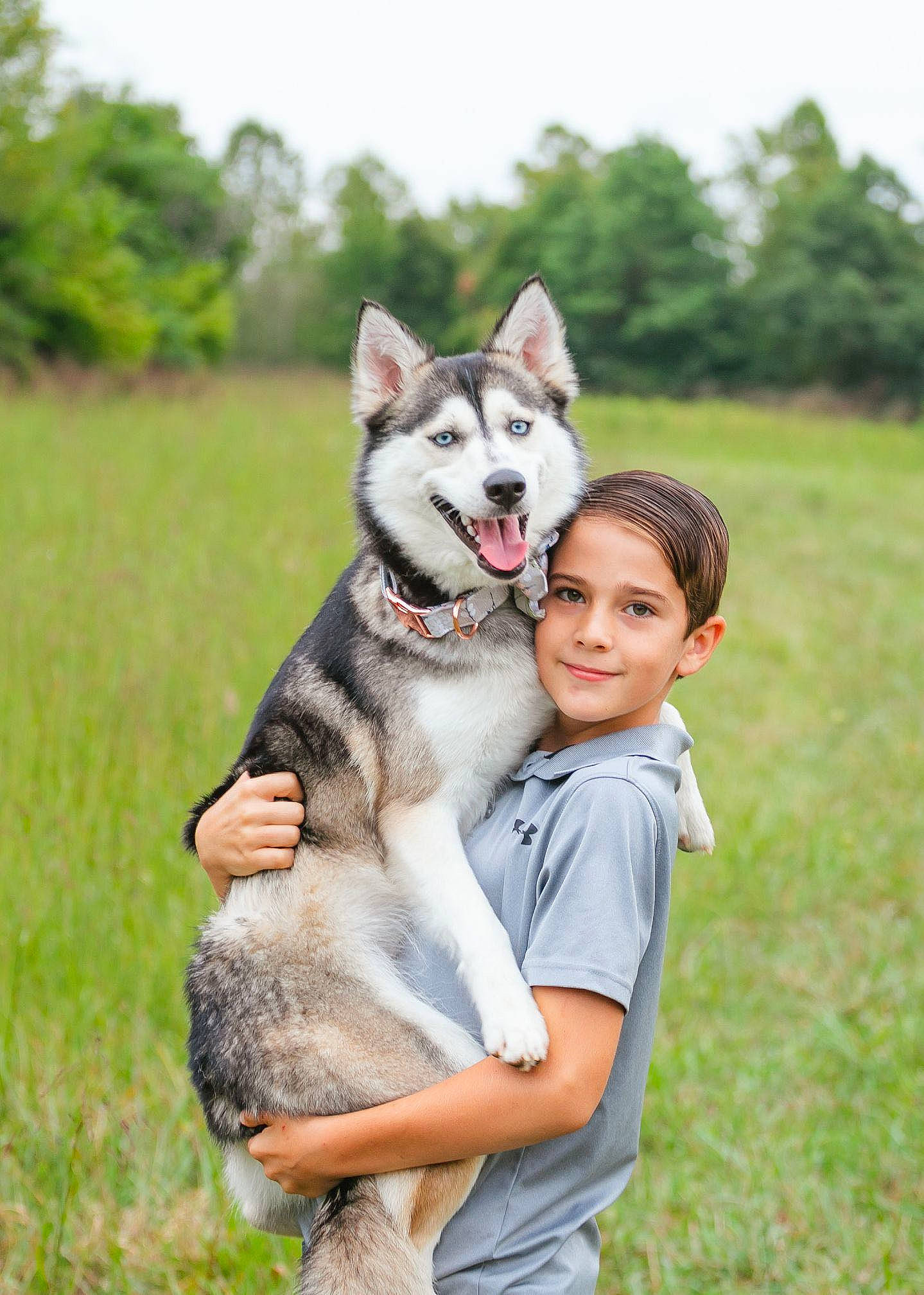 Lily is registered to the contest to win money with this photo: canidae, canis, carnivore, companion_dog, dog, dog_breed, fawn, grass, grassland, happy, mammal, people_in_nature, plant, recreation, sky, sled_dog, smile, sporting_group, tree, working_dog