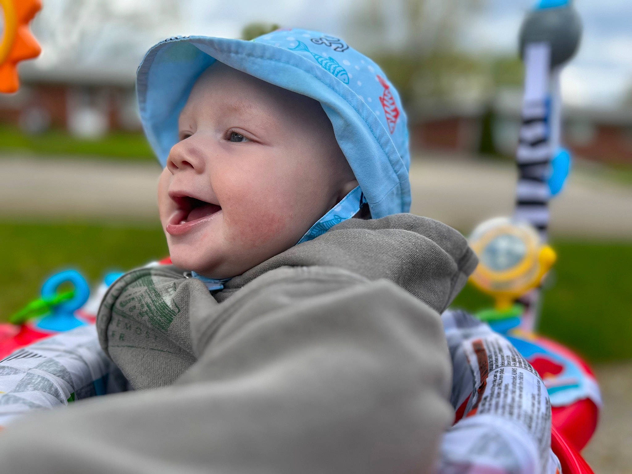 Joziah joined the competition — help win amazing prizes! baby, baby_toddler_clothing, cap, child, electric_blue, facial_expression, fun, grass, happy, hat, headwear, leisure, people, person, personal_protective_equipment, product, recreation, sitting, smile, toddler